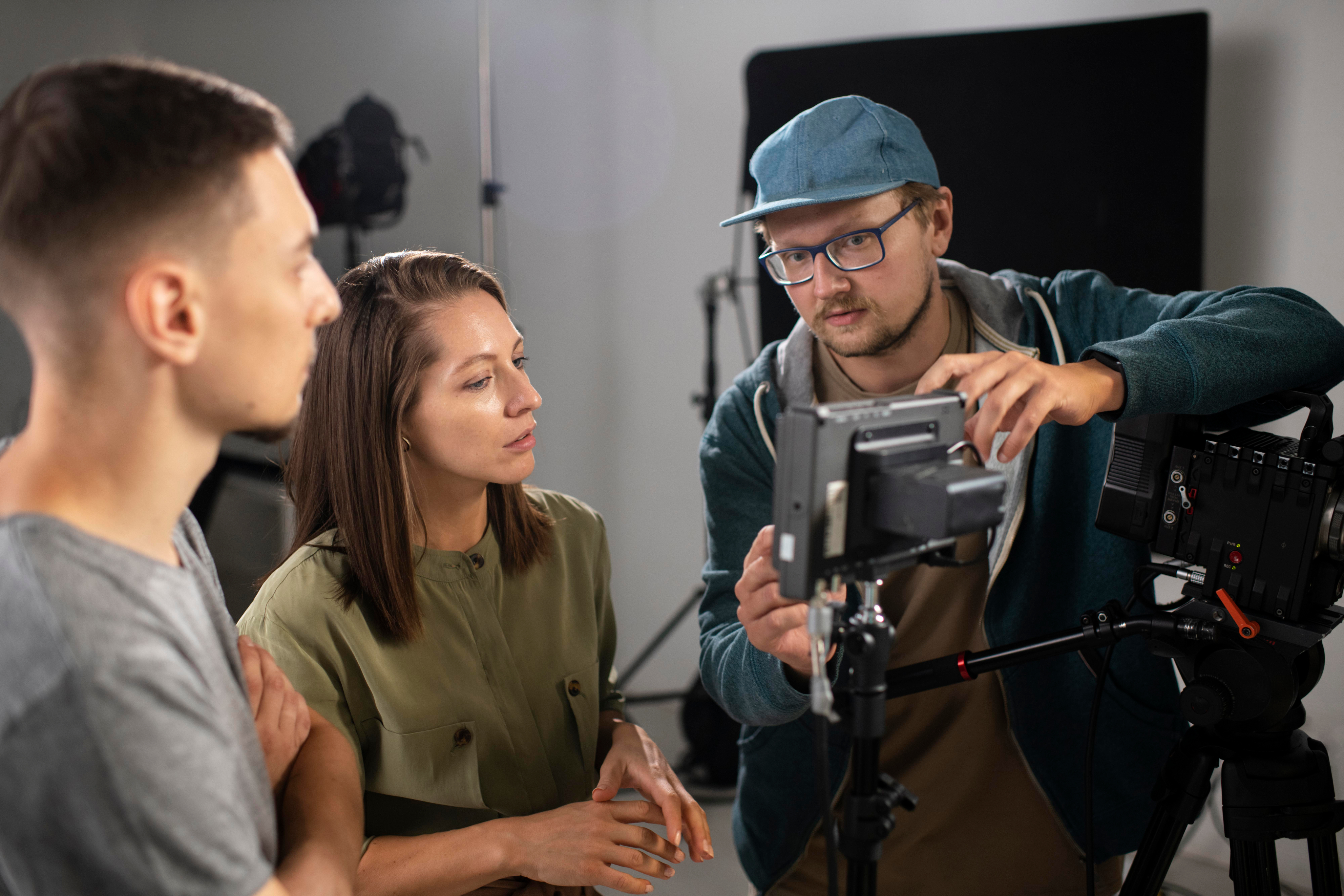 A camera crew sets up a shot in a studio location.