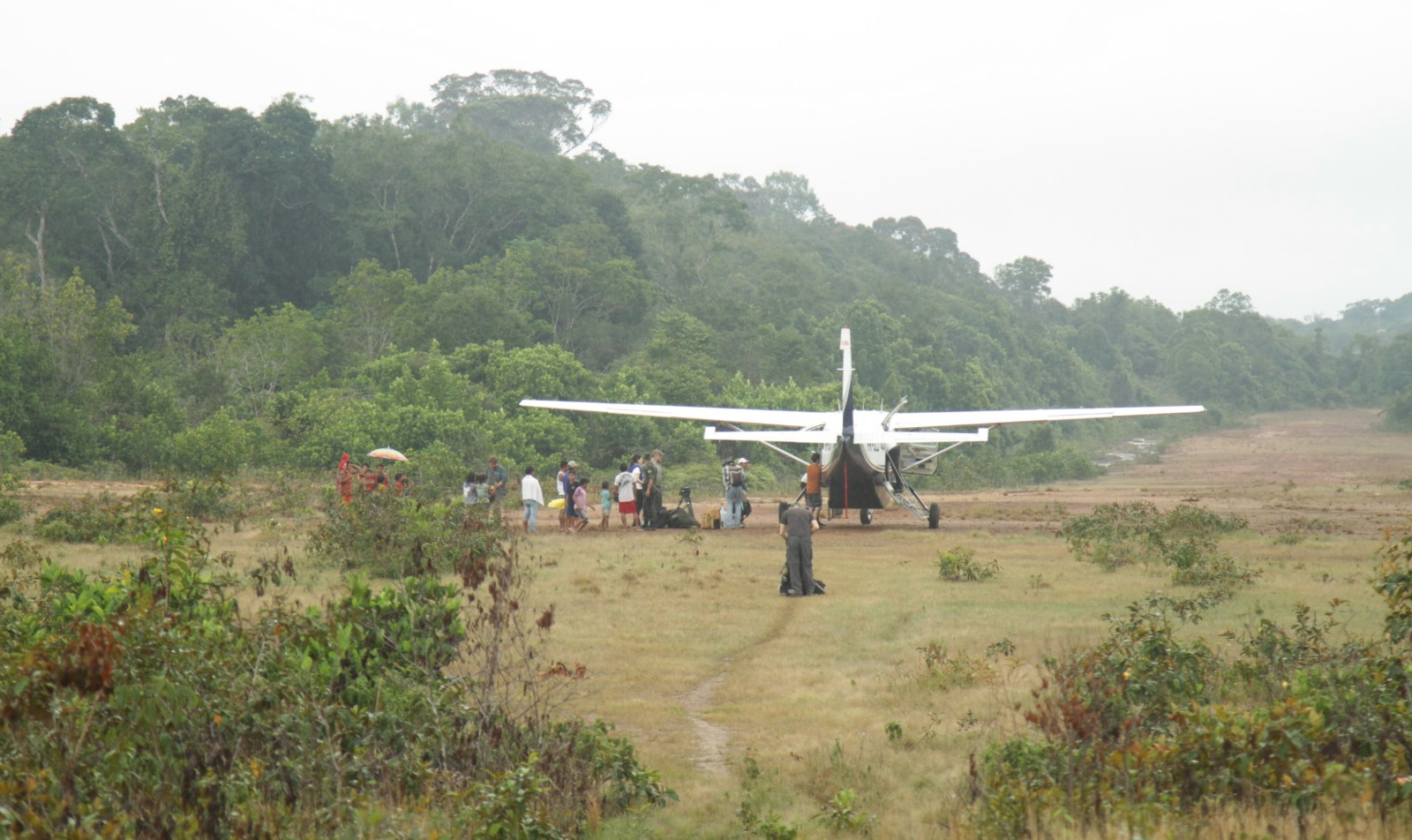 A Brazil Production Services crew deplanes from a 9-seater Caravan in the middle of the Upper Amazon for a shoot for Netflix's Chef's Table with Alex Atala.