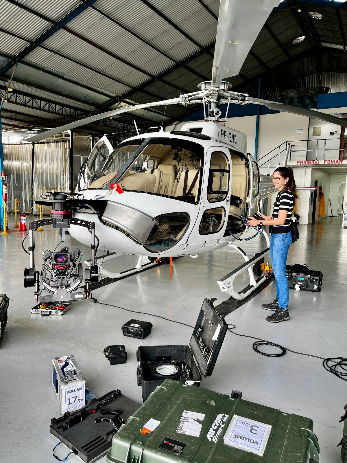 Brazil Production Services's production coordinator Mariana Pascutti stands by a Stab-C stabilization system attached to a helicopter for the VFX unit of Sony's Anaconda (feature film).