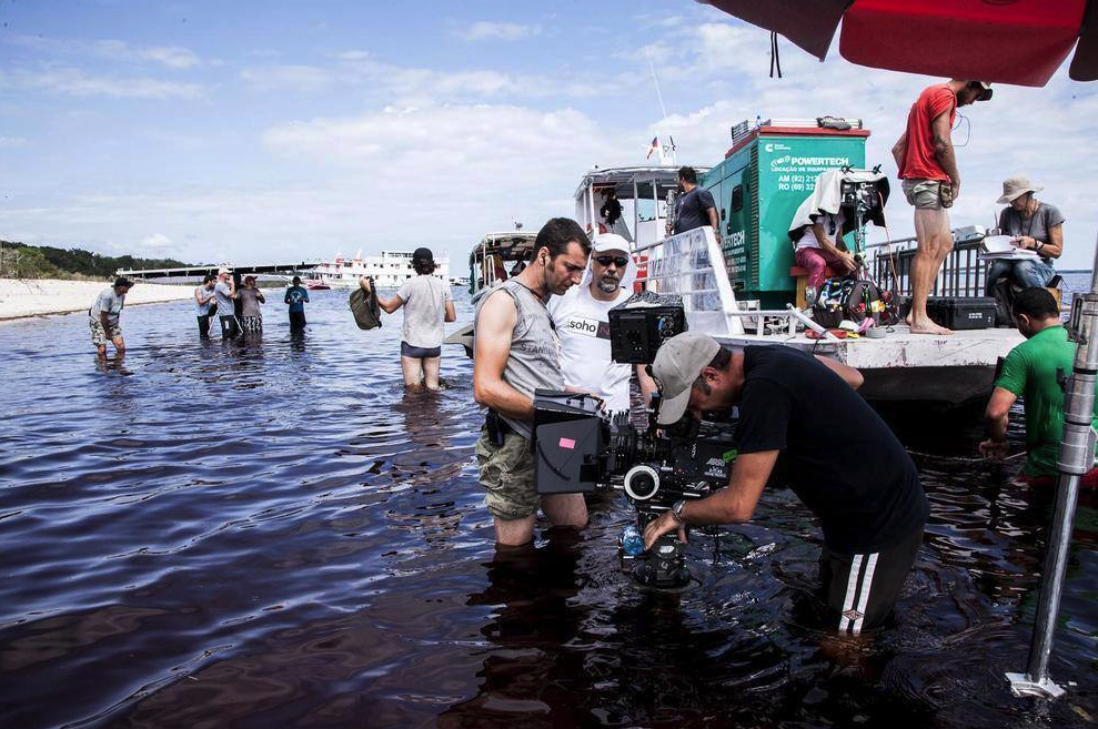 Knee-deep in the waters of the Rio Negro as we set up a shot for a nature documentary in the Amazon Rainforest.