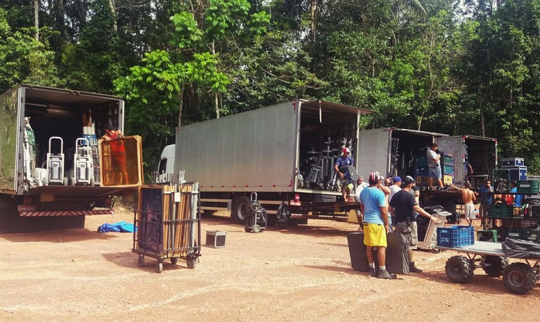 Equipment trucks with grip and electric gear transported from Manaus to a remote area of the jungle for a shoot in the Amazon.