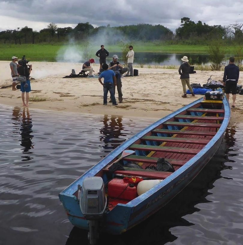 A production set at a beach on the Rio Negro, featuring support from a boat, which BPS often uses for rapid transportation on shoots in remote areas of the Amazon.