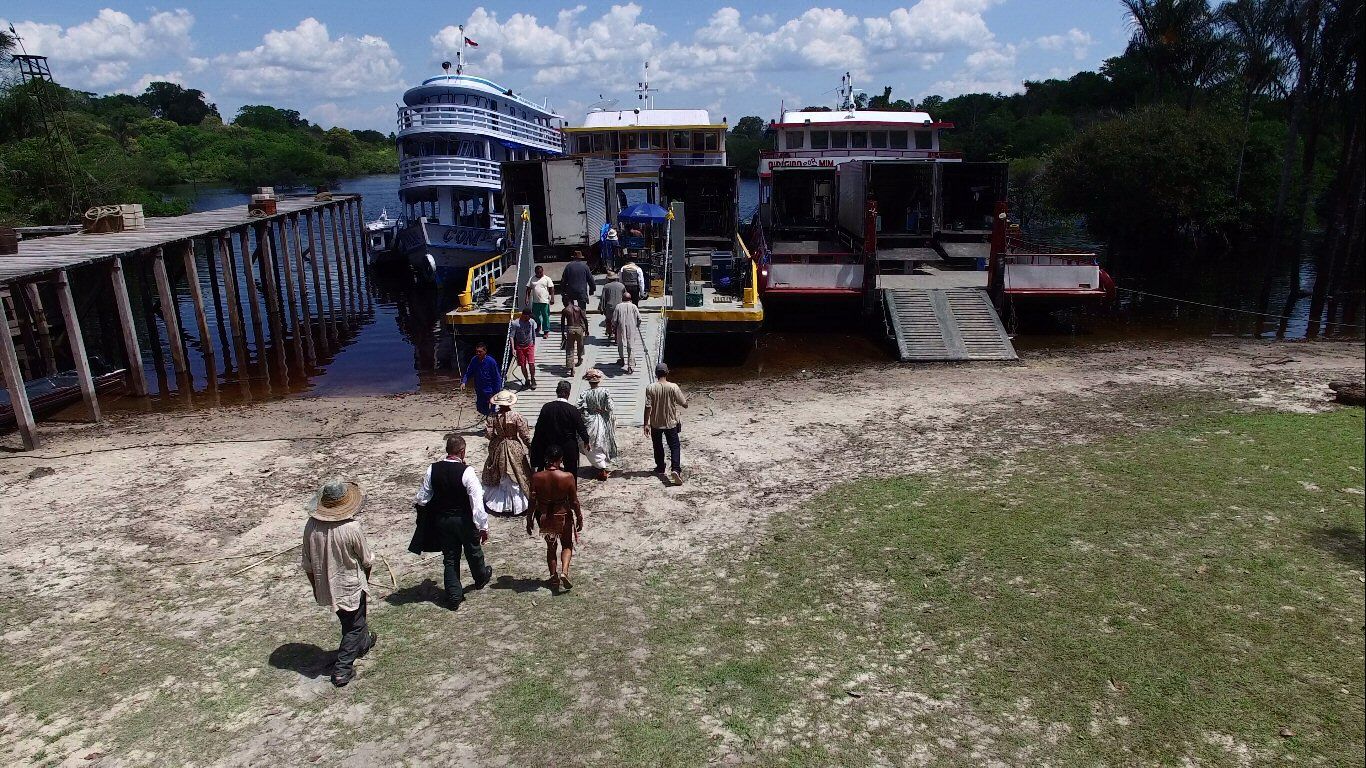 Cast and crew head to an Amazonian river boat for a scene aboard.