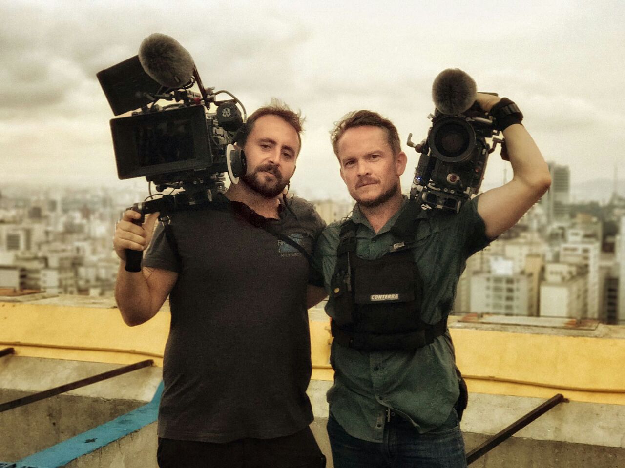 Two BPS camera operators pose for a rooftop shot at a São Paulo helipad on a break from shooting an episode of Netflix's Rapture.