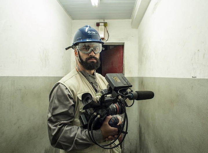 BPS camera operator extraordinaira, Felipe Derzié, poses for a picture during a break from shooting a documentary at a steel mill in the state of Rio de Janeiro, Brazil.