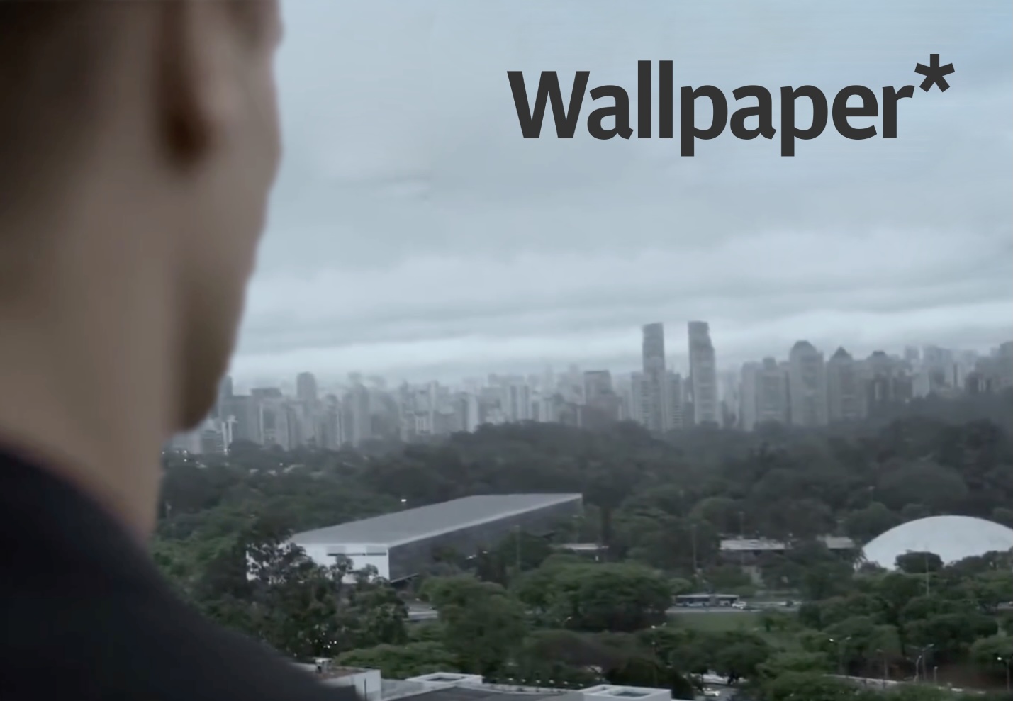 A person looking out over the São Paulo skyline, from the commercial Brazil Production Services produced for Wallpaper Magazine and Pullman Hotels