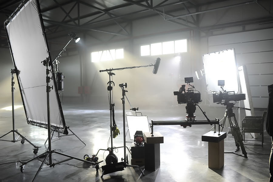 Professional lighting and camera equipment set up inside a photography studio