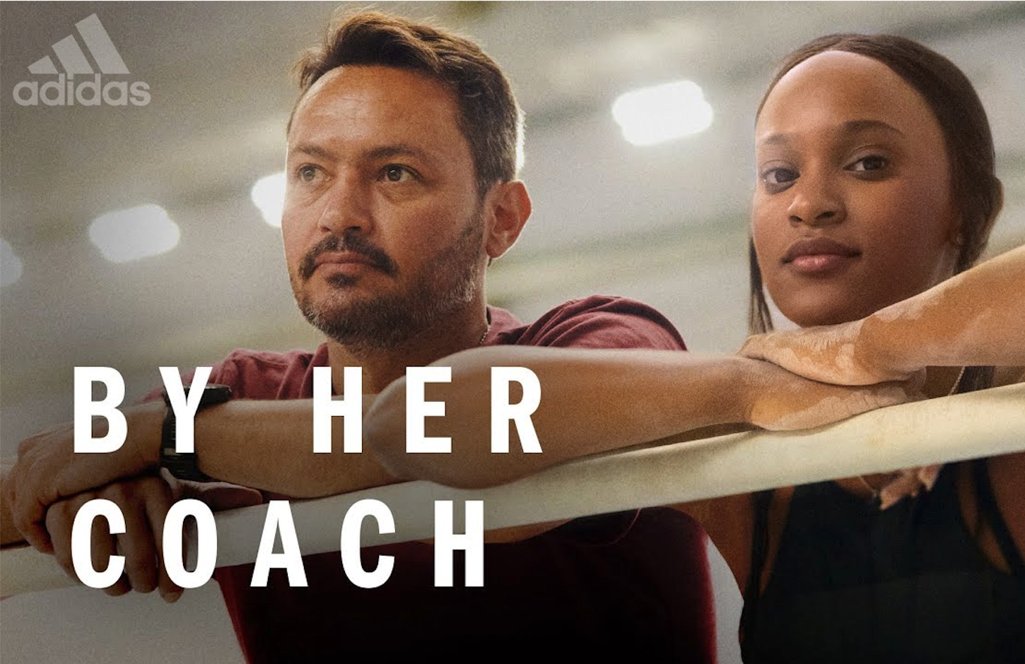 Title card for Adidas: By Her Coach, a documentary produced by Brazil Production Services in Rio de Janeiro featuring Olympic gymnast Rebeca Andrade and her coach Xico Porath
